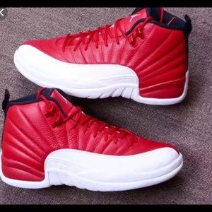 Red and white Jordan 12s